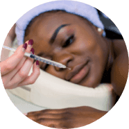 A patient having an anti-wrinkle injection administered above the eyebrow