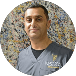 A West Road Dental Practice clinician in branded scrubs