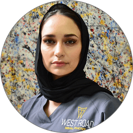 A West Road Dental Practice clinician in branded scrubs