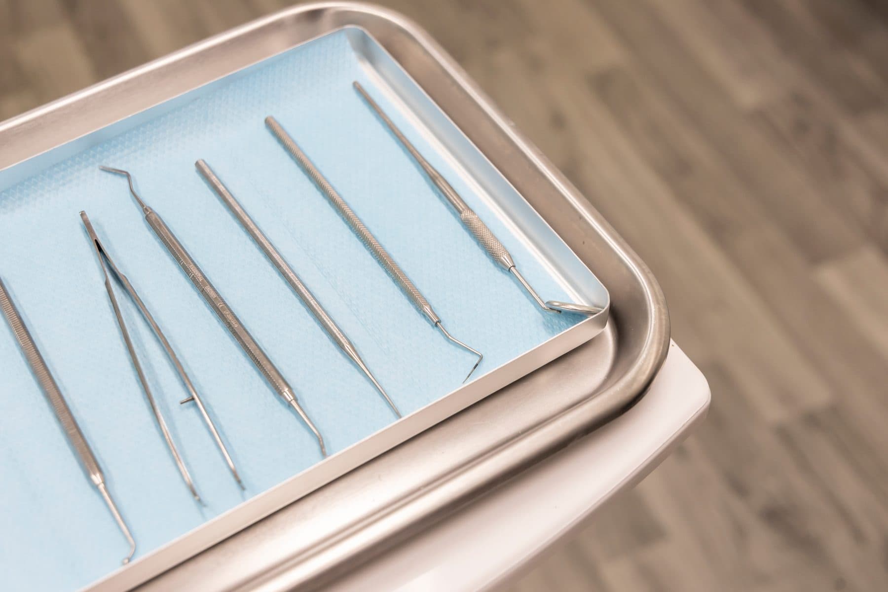Sterile dental instruments laid out on a tray