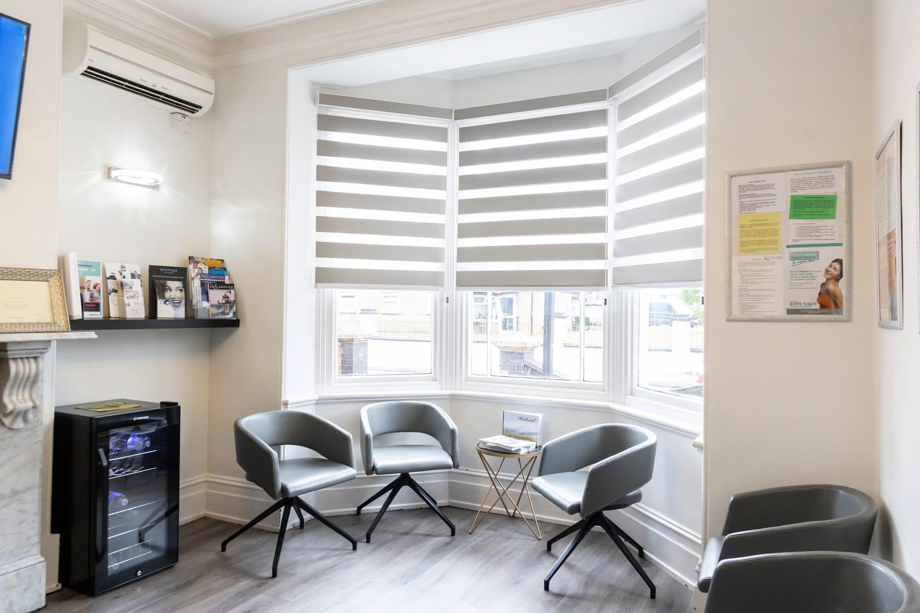 The waiting room at West Road Dental Practice, with seating by a bay window